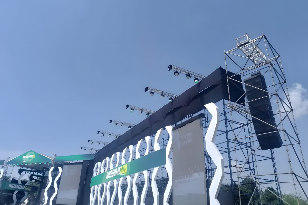 Outdoor LED screen stage on scaffold towers, built by MoSound