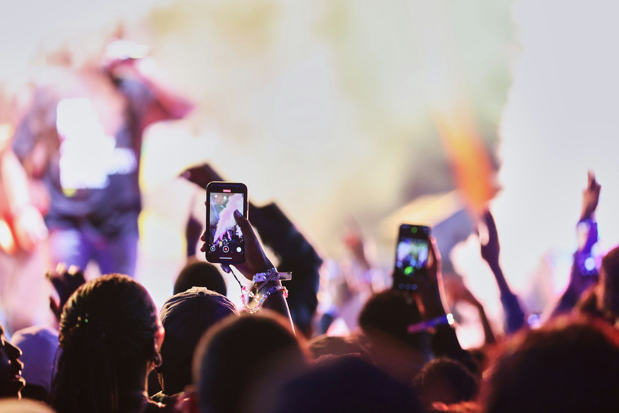 Concert crowd in Nairobi with phones raised towards the stage